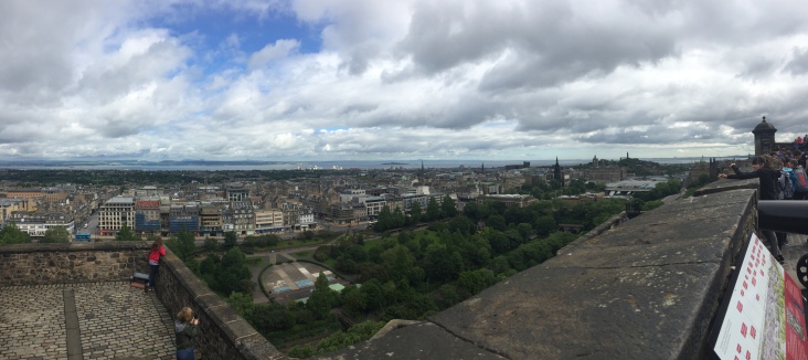 Children view the city of Edinburgh from the ramparts of the castle