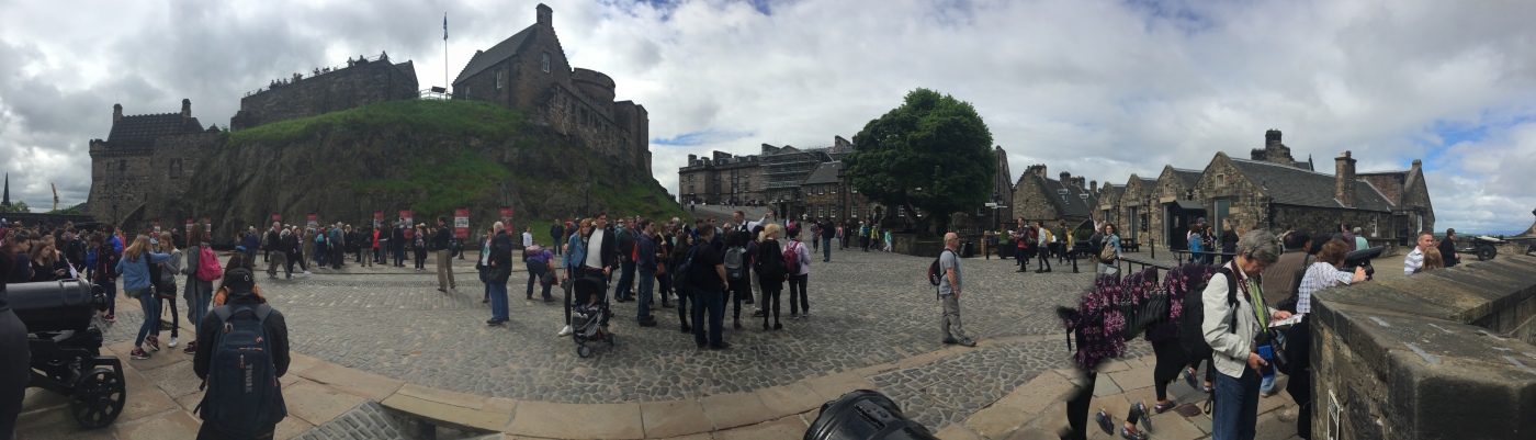 Crowds gather in the courtyard as tourists view different parts of Edinburgh Castle