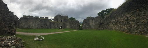 The courtyard of Inverlochy Castle surrounded by crumbling walls